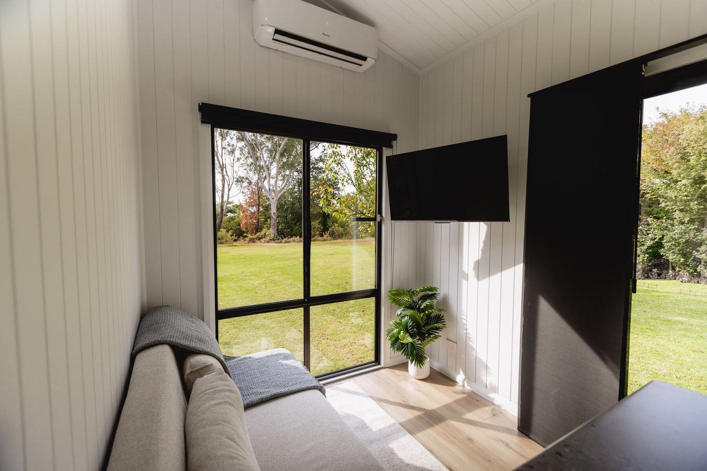 The Panarama living area with cathedral ceiling and floating timber floors
