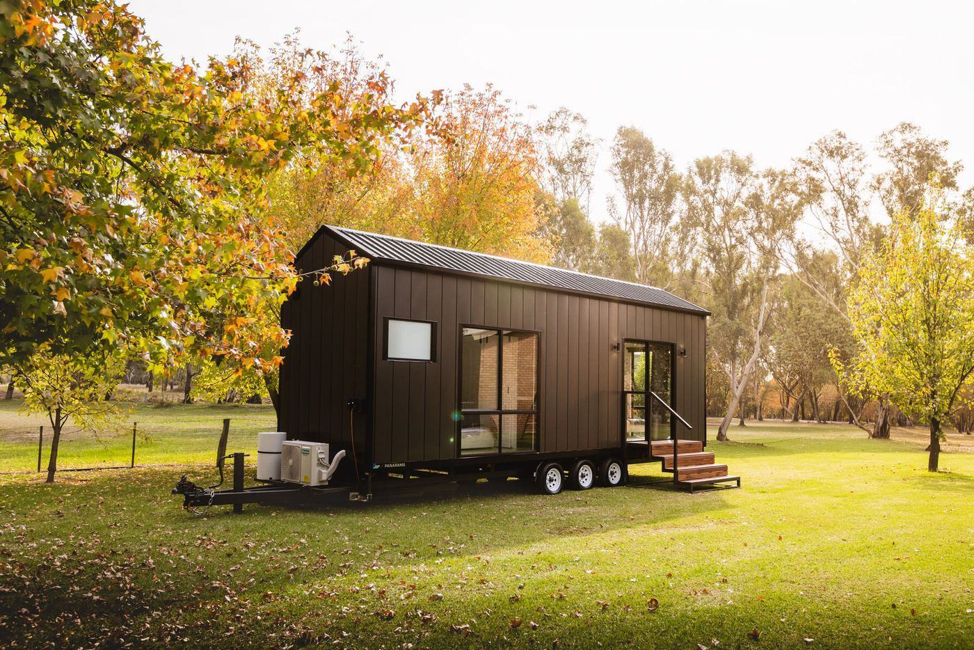 The Panarama tiny home by ZBR Tiny Homes, exterior view at dusk